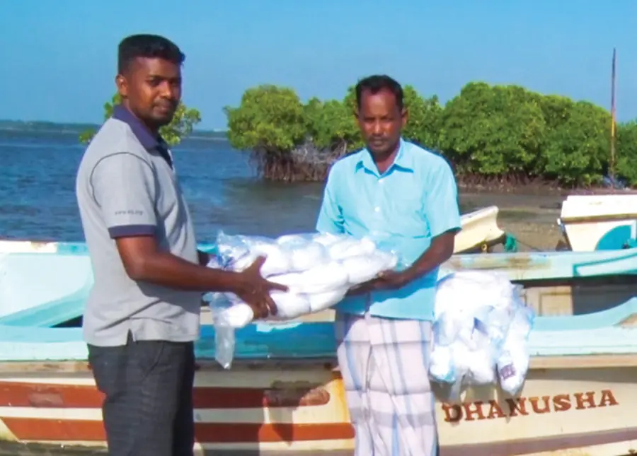 Fishing nets handed over to a fisherman